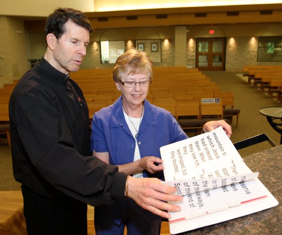 Fr. Bob White with parishioner Mary Bishop