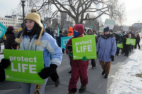 Pro-life supporters marched in below-zero temperatures around the state Capitol grounds Jan. 22 during Minnesota Citizens Concerned for Life's annual March for Life and rally on the Capitol steps in St. Paul. The event began with an ecumenical prayer service at the Cathedral of St. Paul. During the service, Bishop Lee Piché recognized the many teenagers and young adults present and thanked them for giving hope to the future of the pro-life movement. Afterward, many braved the cold to march to the Capitol while others stayed to pray at the Cathedral. (Dianne Towalski/The Catholic Spirit)