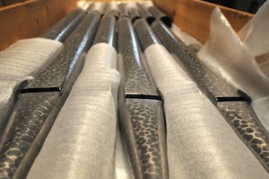Pipes are stacked in crates waiting to be installed into the new organ casework.
