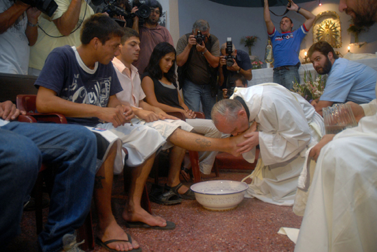 Argentine Cardinal Jorge Mario Bergoglio washes and kisses the feet of residents of a shelter for drug users during Holy Thursday Mass in 2008 at a church in a poor neighborhood of Buenos Aires, Argentina.  (CNS photo/Enrique Garcia Medina, Reuters)