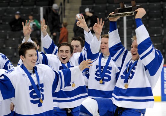 From left, senior forward Jack Stang, senior forward Danny McManus, sophomore defenseman Seamus Donohue, junior defenseman Zach Weier and senior forward Alex Johnson of St. Thomas Academy in Mendota Heights celebrate their team’s 5-4 win over Hermantown in the Class A championship game March 9 at the Xcel Energy Center in St. Paul. The win gave the Cadets a three-peat in Class A, with all of their wins in the finals coming against Hermantown. St. Thomas Academy will move up to Class AA next season. STA senior goalie David Zevnik won the Frank Brimsek Senior Goalie Award. Zevnik helped the Cadets to their third consecutive Class A championship by compiling a 1.20 goals-against average and a .939 save percentage. In Class AA, Hill-Murray lost to Edina 4-2 in the finals to finish second for the second year in a row. Last year, the Pioneers lost to Benilde-St. Margaret’s in the championship game. Dr. Peter Bretzman / For The Catholic Spirit