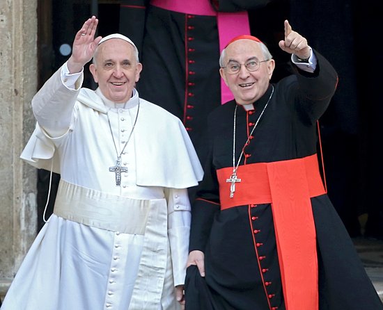 Newly elected Pope Francis, Cardinal Jorge Mario Bergoglio of Argentina, waves after praying at the Basilica of St. Mary Major in Rome March 14. At right is Cardinal Agostino Vallini, papal vicar for Rome. (CNS photo/Alessandro Bianchi, Reuters) 