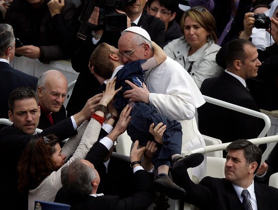 This photo by AP photographer Gregorio Borgia of Pope Francis embracing 8-year-old Dominic Gondreau, who has cerebral palsy, captured the attention of people around the world. Gregorio Borgia, AP via CNS
