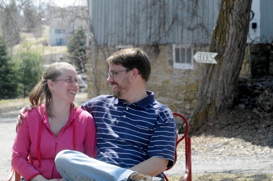 Christopher Hagen and his wife Christelle relax on Claret Farm outside of Stillwater April 27. The farm also is home to Loome Theological Booksellers, which Hagen relocated from its previous location in Stillwater. Dianne Towalski / The Catholic Spirit
