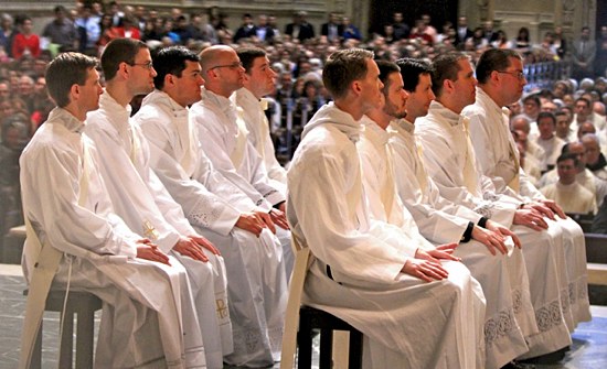 Archbishop John Nienstedt ordained 10 men to the priesthood for the Archdiocese of St. Paul and Minneapolis on May 25 at the Cathedral of St. Paul. The men comprised the largest ordination class since 2005. From left, Deacons Leonard Andrie, John Drees, Spencer Howe, Luke Marquard, James Peterson, Andrew Brinkman, Joah Ellis, Andrew Jaspers, Brian Park and Andrew Stueve listen to Archbishop Nienstedt during his homily. (Dave Hrbacek / The Catholic Spirit)
