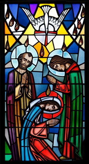 A scene from Pentecost is depicted in this stained-glass window. CNS photo / Gregory A. Shemitz, Long Island Catholic