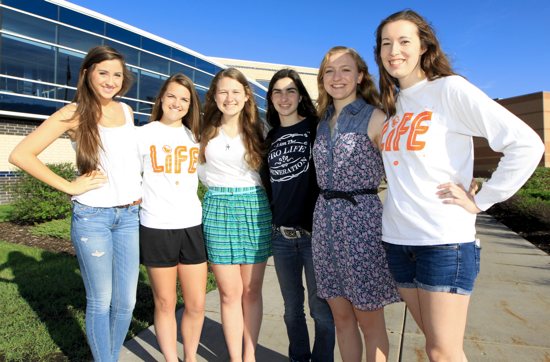 From left, Miranda Kroyer, Hailey Zweber, Leah Purselike, Alicia Curti, Kara Steichen, and Jayme Jones of Lakers4Life pose in front of their school, Prior Lake High School. Curti and Jones are seniors, Kroyer, Zweber and Preslicka are juniors and Steichen is a sophomore. Dave Hrbacek / The Catholic Spirit