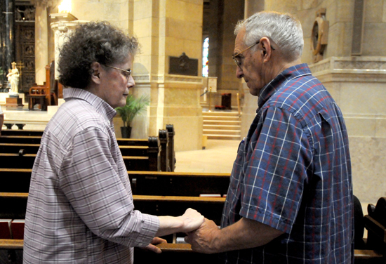 Richard and Pat Erickson, parents of Father John Paul Erickson, held hands as they renewed their vows during the Mass.