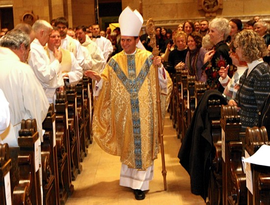 Bishop Cozzens walks the aisles of the Cathedral to give his Episcopal Blessing to the congregation.