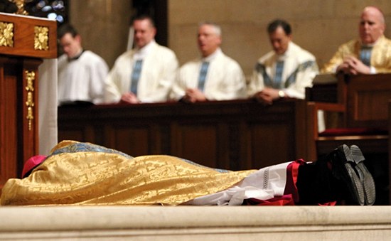 Bishop Cozzens lies prostrate during the Litany of Supplication.