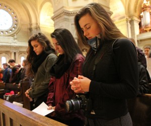 From left, Olivia Illi, Mara Yapello and Izzi Boo of St. Jude of the Lake in Mahtomedi join with others in prayer at the Cathedral of St. Paul during the Prayer Service for Life. They all are students at Mahtomedi High School and run Students for Life at their school.  Dave Hrbacek/The Catholic Spirit