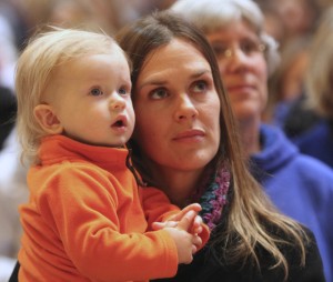 Aja Vogel of St. Peter in Forest Lake and her son Ryker listen to Bishop Lee Piché during the Prayer Service for Life.  Dave Hrbacek/The Catholic Spirit