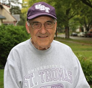 Deacon Jerry Devine can't remember the last time he missed a football game between the University of St. Thomas and St. John's University. He went to his first one in 1965. Dave Hrbacek/The Catholic Spirit