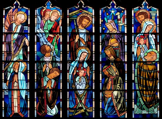 A large stained glass window featuring a nativity scene overlooks the choir loft of Holy Family in St. Louis Park. It was designed and manufactured by Reinarts Stained Glass Studios, Inc. in Winona between 1978 and 1980. The artist was Milton Frenzel. Courtesy Reinarts Stained Glass Studio, Inc.