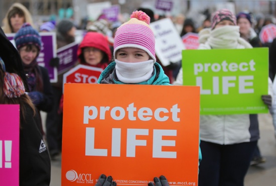Olivia Rome of St. Hubert in Chanhassen walks on the State Capitol mall Jan. 22 during the pro-life rally following a prayer service at the Cathedral of St. Paul.