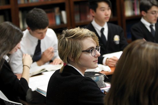 Sophomore Sophia Rybarczyk listens to Ahlquist during a theology class. Dave Hrbacek/The Catholic Spirit