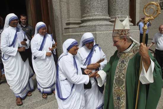 Missionaries of Charity sisters greet Archbishop Bernard Hebda outside the Cathedral after Mass. In his homily, Archbishop Hebda said he’ll say the prayer of Cardinal John Henry Newman that the sisters recite daily, asking Jesus to “shine through me and be so in me that every soul I come in contact with may feel your presence in my soul.” Dave Hrbacek/The Catholic Spirit