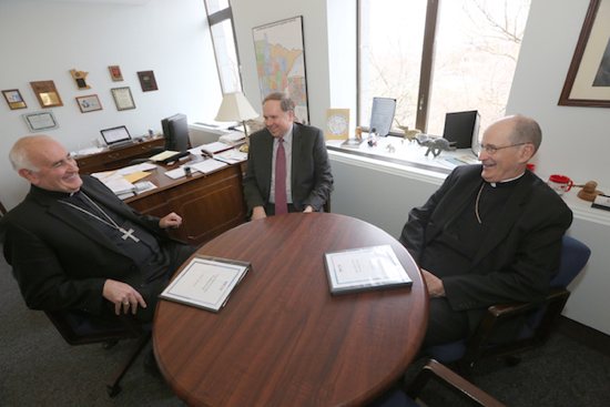 Bishops Donald Kettler of St. Cloud and John LeVoir of New Ulm meet with State Representative Jim Knoblach of St. Cloud in his office March 16. Dave Hrbacek / For The Visitor