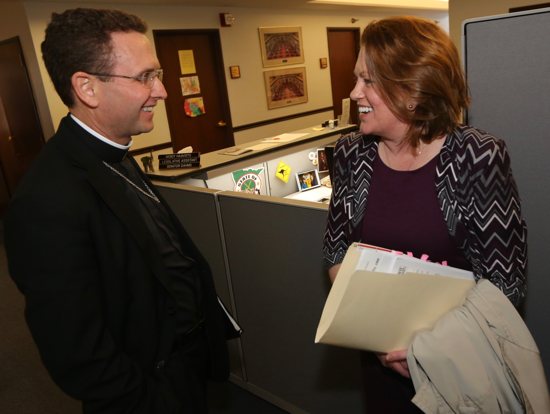 Bishop Andrew Cozens talks with Sen. Michelle Benson, R-Ham Lake, at the State Capitol March 16, a day in which Minnesota’s six bishops visited the Capitol and met with Republican and Democratic legislators. Dave Hrbacek/The Catholic Spirit