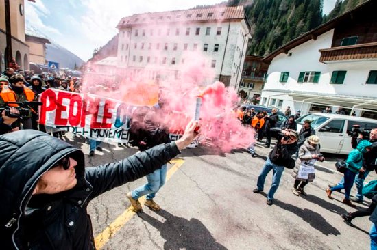 People demonstrate against the Austrian government's planned re-introduction of border controls at the Brenner Pass April 24. Bishop Agidius Zsfikovics of Eisenstadt has refused to allow an anti-refugee border fence across land belonging to his diocese, saying the government-backed move violates Christian values. CNS photo/Jan Hetfleisch, EPA
