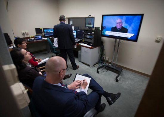 Media personnel at the U.S. Conference of Catholic Bishops in Washington monitor a live broadcast about Pope Francis' apostolic exhortation on family life April 8. CNS photo/Tyler Orsburn