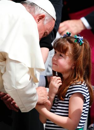 Pope Francis greets Lizzy Myers of Mansfield, Ohio, during his general audience in St. Peter's Square at the Vatican April 6. Myers, who has a disease that is gradually rendering her blind and deaf, met the pope as part of her "visual bucket list." CNS photo/Paul Haring