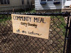 A sign outside of the Rye House announces its weekly community dinners. Maria Wiering/The Catholic Spirit