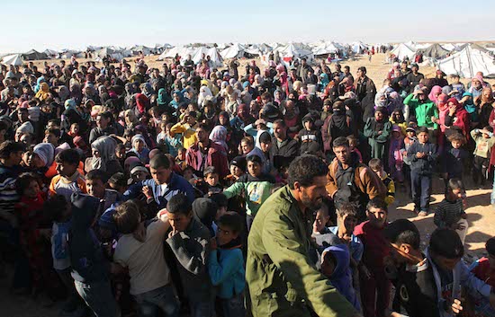 Syrian refugees wait at the border Jan. 13 near Royashed, Jordan. Catholic Relief Services has aided more than 1 million refugees since the beginning of the Syrian civil war five years ago, CRS' regional director Kevin Hartigan said. CNS photo/EPA