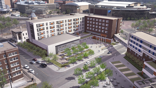 With downtown St. Paul in the background, the is is an artist's rendering of the new Higher Ground St. Paul under construction, an expansion of Catholic Charities' Dorothy Day Center. At right is the planned second phase of the project, the St. Paul Opportunity Center with services provided on the first floor and the Dorothy Day Residence on the second.