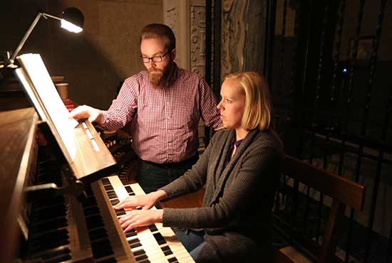 From left, organists Joel Kumro of Our Lady of Peace in Minneapolis and Anne Phillips of Epiphany in Coon Rapids practice at the Basilica of St. Mary in Minneapolis. Both are organists and music directors at their parishes. Dave Hrbacek/The Catholic Spirit