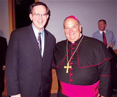 Childhood friend and classmate Tom Ryan, a parishioner of St. Mary of the Lake in Plymouth, poses with Bishop Bernard Hebda at his ordination in Gaylord, Michigan, in 2009. Courtesy Tom Ryan