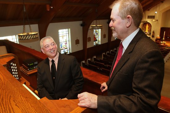 Organist Paul Cartier chats with Raymond Henderson, liturgical music director at Our Lady of Hope Parish in 2015 in Carle Place, N.Y. Organist Paul Cartier chats with Raymond Henderson, liturgical music director at Our Lady of Hope Parish in 2015 in Carle Place, N.Y. A new Department of Labor rule raises the salary threshold for overtime pay for many workers, meaning some parish staffs and other employers will have to readjust their budgets to accommodate the increased personnel costs. CNS/Gregory A. Shemitz