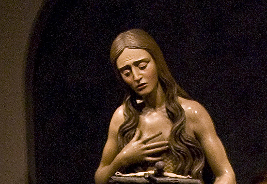 St. Mary Magdalene is shown meditating on the crucifix in this painted wooden sculpture that is part of The Sacred Made Real exhibit in 2010 at the National Galley of Art in Washington. CNS/Nancy Wiechec