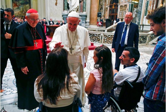 Pope Francis blesses a woman as he meets the disabled during the opening of the Diocese of Rome's annual pastoral conference at the Basilica of St. John Lateran in Rome June 16. CNS photo/Tony Gentile, Reuters
