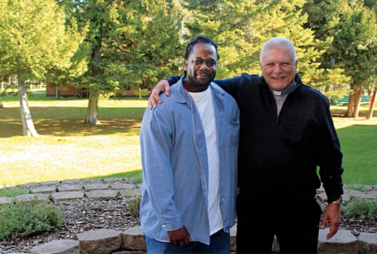Tyrece Matthews, left, stands with Deacon Timothy Zinda, coordinator of correctional ministries for the Archdiocese of St. Paul and Minneapolis, an outreach supported by the Catholic Services Appeal. Deacon Zinda’s parish, St. Paul in Ham Lake, is launching EMBRACE, a program designed to help former offenders transition to life after prison. The parish plans to help Matthews after he is released from prison in March. Courtesy Deacon Zinda