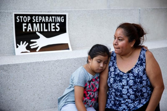 A mother and daughter in Los Angeles react after the U.S. Supreme Court issued a split ruling June 23 blocking President Barack Obama's executive actions to temporarily stop deportations. CNS photo/Eugene Garcia, EPA)