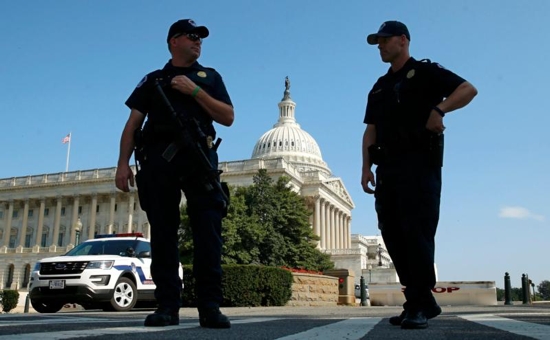 U.S. Capitol Police officers stand outside the Capitol July 8 in Washington. In a bipartisan 245-182 vote, House members July 13 passed the Conscience Protection Act, which would provide legal protection to doctors, nurses, hospitals and all health care providers who choose not to provide abortions as part of their health care practice. CNS photo/Kevin Lamarque, Reuters