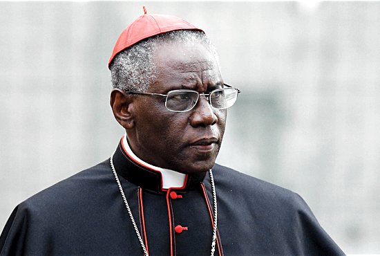 Cardinal Robert Sarah, prefect of the Congregation for Divine Worship and the Sacraments, is pictured at the Vatican in this Oct. 9, 2012, file photo. Cardinal Sarah, the Vatican’s liturgy chief, has encouraged priests to begin celebrating the Eucharist facing east, the same direction the congregation faces. Cardinal Sarah made his request during a speech at the Sacra Liturgia conference in London  July 5. CNS/Paul Haring