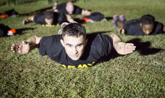 Father Adam Muda, a priest from the Diocese of Paterson, N.J., participates in physical training exercises at Fort Jackson in Columbia, S.C., in March as part of his training to become an Army chaplain. CNS photo/Chaz Muth