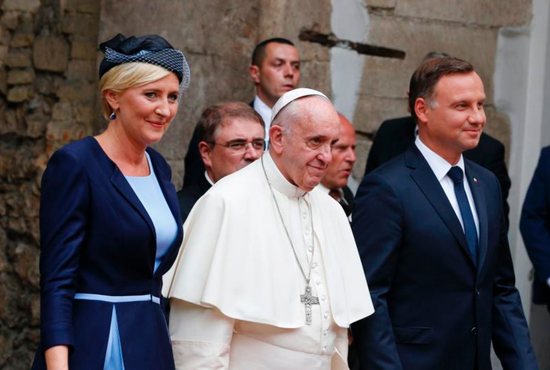 Pope Francis, Polish President Andrzej Duda and first lady Agata Kornhauser-Duda arrive for a meeting with government authorities and the diplomatic corps in the courtyard of Wawel Royal Castle in Krakow, Poland, July 27. CNS photo/Paul Haring