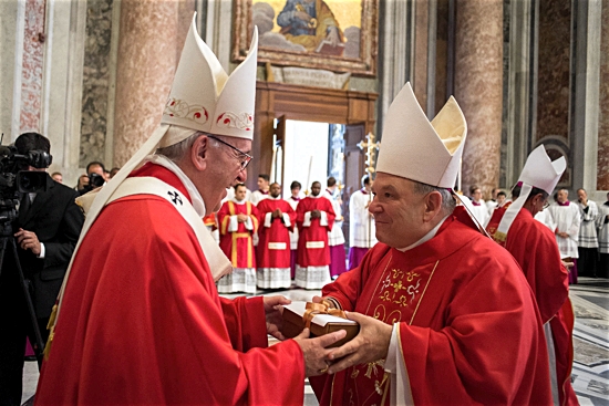 Pope Francis presents Archbishop Bernard Hebda with his pallium at the Vatican June 29, the feast of Sts. Peter and Paul. L’Osservatore Romano