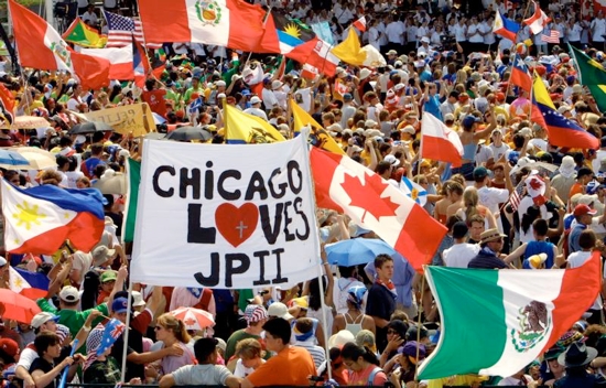 A large crowd, including Chicago youths and other World Youth Day pilgrims, gather to welcome St. John Paul II to Toronto in 2002. The largest U.S. group to attend a World Youth Day outside of North America, 30,000 American pilgrims plan to attend the July 26-31 festival in Krakow, Poland. They will join 2.5 million pilgrims from around the world. CNS photo/Nancy Wiechec