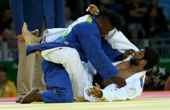 Refugee Olympic Team's Popole Misenga, left, and Avtar Singh of India compete in judo during the Summer Olympics in Rio de Janeiro Aug. 10. CNS photo/Toru Hanai, Reuters