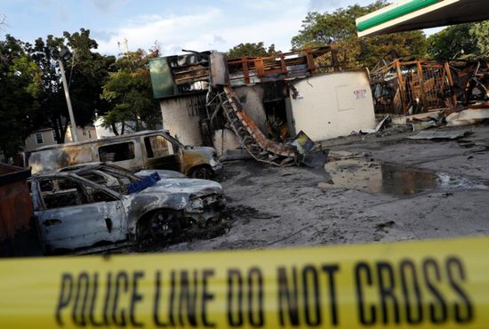 A gas station is seen Aug. 15 after it was burned down following the police shooting of a man in Milwaukee the previous day. CNS photo/Aaron P. Bernstein, Reuters