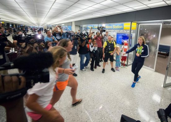 U.S. Olympic swimmer Katie Ledecky greets fans at Dulles International Airport in Virginia Aug. 17, after returning home from the Summer Games in Rio de Janeiro. CNS photo/Jaclyn Lippelmann, Catholic Standard)