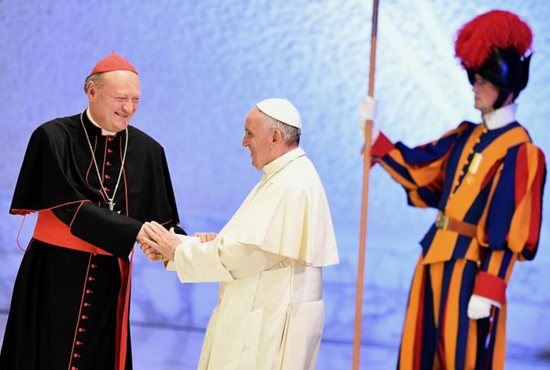 Cardinal Gianfranco Ravasi, president of the Pontifical Council for Culture, greets Pope Francis during the opening ceremony of a world conference on faith and sport Oct. 5 in the Vatican's Paul VI audience hall. CNS photo/Ettore Ferrari, EPA