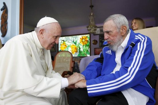 Pope Francis and former Cuban President Fidel Castro grasp each other's hands at Castro's residence in Havana Sept. 20, 2015. Castro, who seized power in a 1959 revolution and governed Cuba until 2006, died Nov. 25 at the age of 90. CNS photo/Alex Castro, AIN handout via Reuters