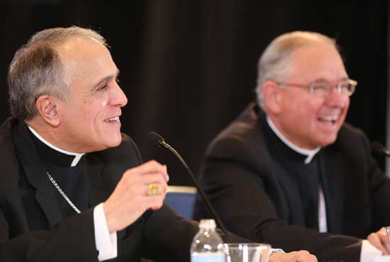 Cardinal Daniel N. DiNardo of Galveston-Houston addresses a news conference Nov. 15 at the fall general assembly of the U.S. Conference of Catholic Bishops in Baltimore. The cardinal was elected USCCB president that morning. Seated to his left is Archbishop Jose H. Gomez of Los Angeles, who was elected USCCB vice president. CNS /Bob Roller