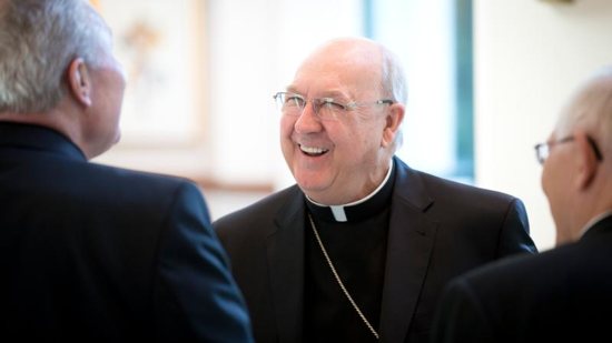 Bishop Kevin Farrell, who headed the Dallas Diocese from 2007 until mid-August, laughs with other bishops at the U.S. Conference of Catholic Bishops' building in Washington Sept. 13. He is now the prefect of the new Vatican office for laity, family and life. CNS photo/Tyler Orsburn