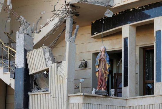A damaged statue of Mary is seen in a church in Qaraqosh, Iraq, Nov. 25. CNS photo/Goran Tomasevic, Reuters